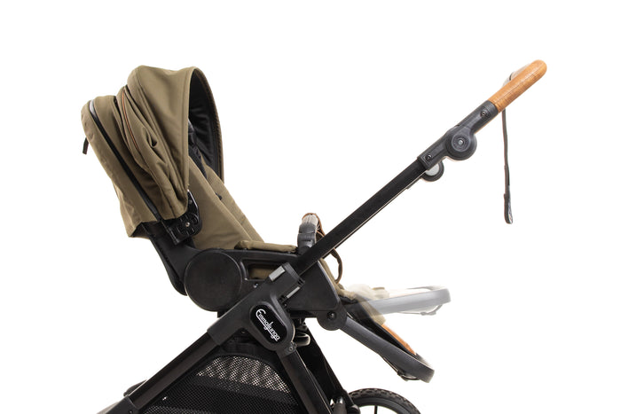 A hand demonstrating the seat’s adjustable footrest