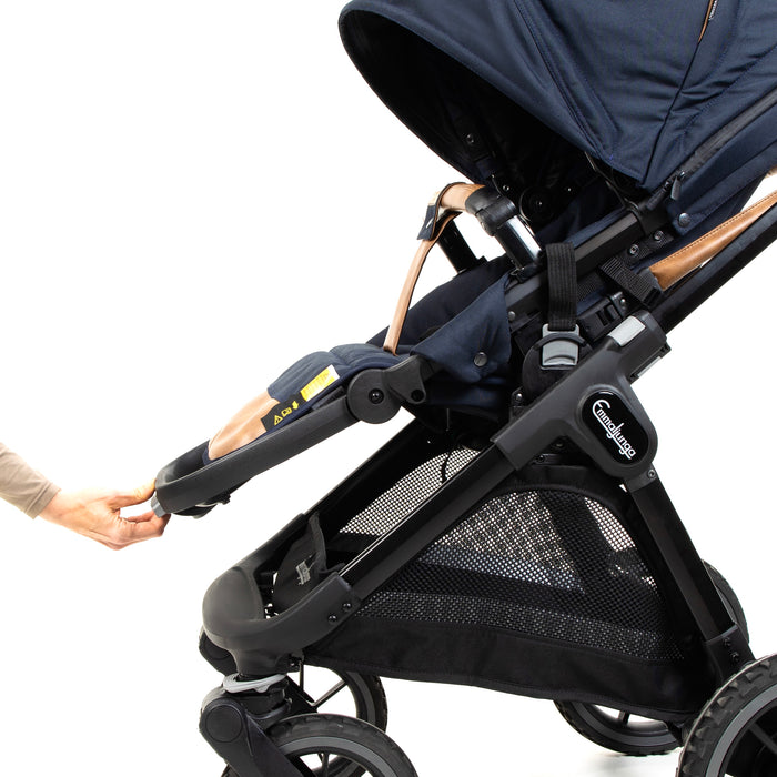 A hand demonstrating the seat’s adjustable footrest